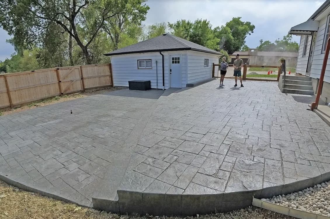 Extended patio with stamped concrete